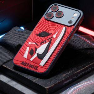 Assureify phone case featuring a bold, artistic red and black abstract pattern for iPhone.